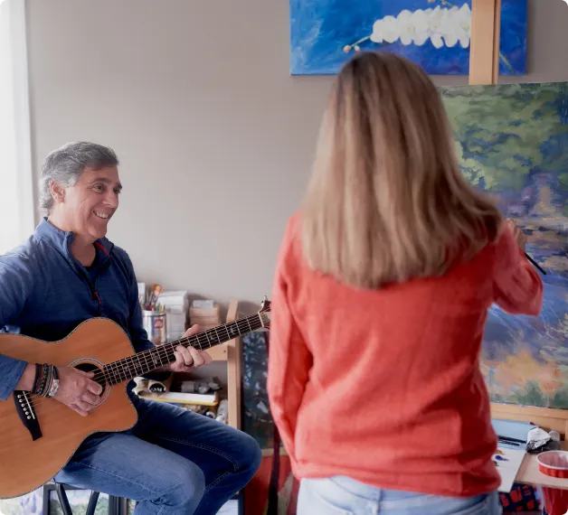 Michael and Lisa at one of their paint-and-play sessions, where everything looks better under energy-efficient LED lighting.