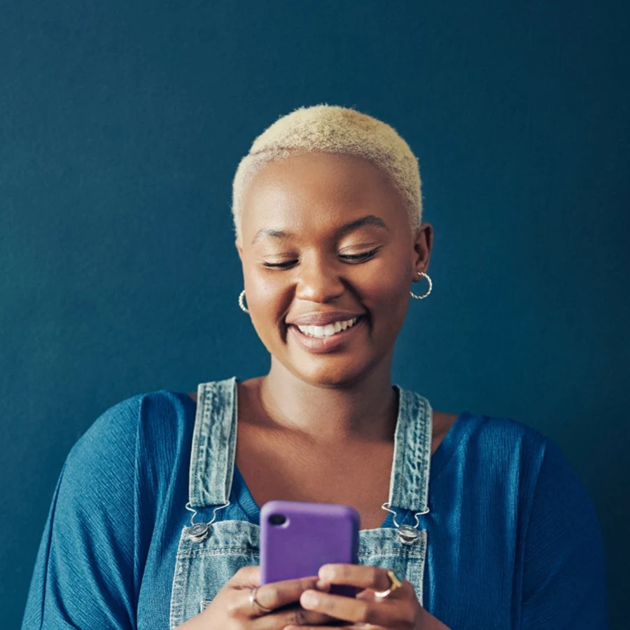 women smiling at phone